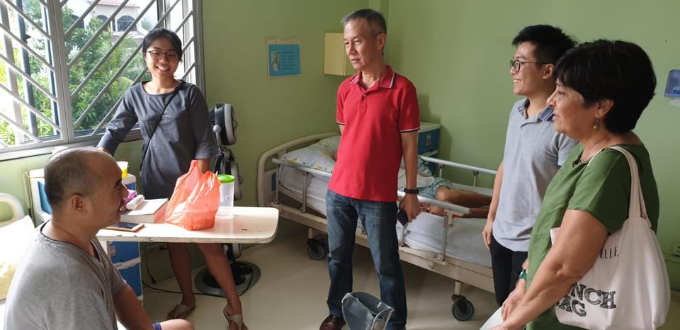HealthServe staff and intern visiting SL at the nursing home